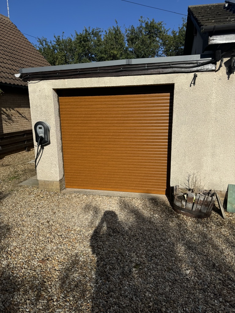 Completed timber-effect roller garage door installation